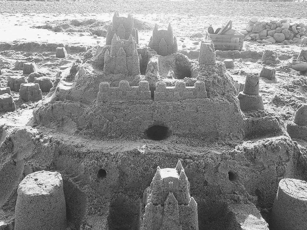 Black and white photo of a sand castle built on Scituate, Massachusettes