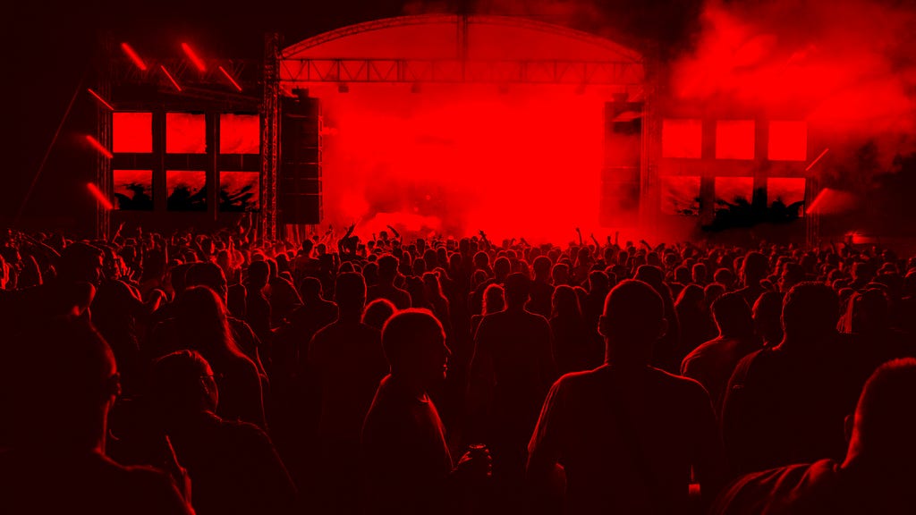 A crowd in a concert, toned in red.