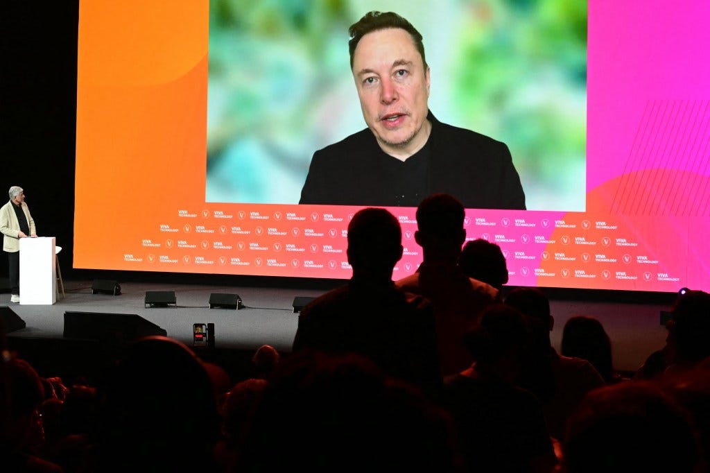 During his remote appearance at the Viva Technology conference in Paris on Thursday, Elon Musk was asked whether he was concerned about losing his job to AI, AFP via Getty Images