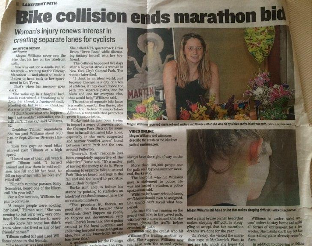 A photo of a newspaper article. Article Title: Bike collision ends marathon bid. Article subtitle: Woman’s injury renews interest in creating separate lanes for cyclists. Large featured photo showing Megan in her Chicago apartment surrounded by flowers and a balloon. Below, a smaller picture of the back of Megan’s head and neck with a large bruise.
