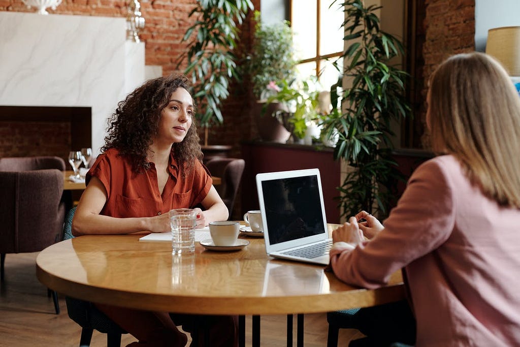 Two women talking or interviewing