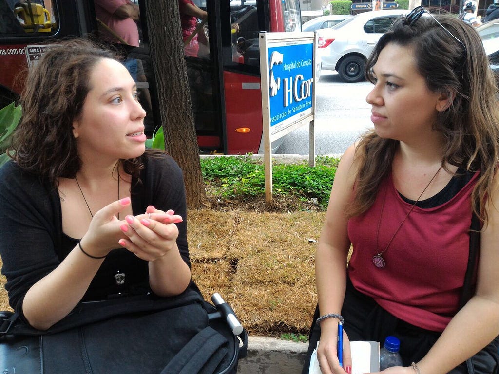 2 woman talking in the street