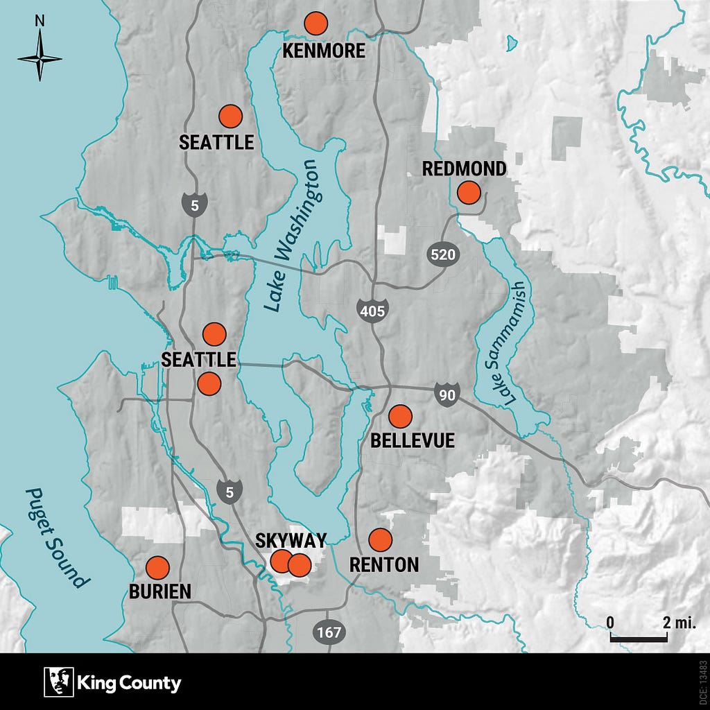 A map of King County with orange dots marking locations of affordable housing developments in Seattle, Kenmore, Redmond, Bellevue, Burien, Skyway and Renton.