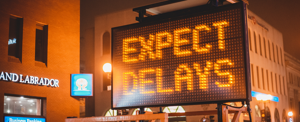 Signboard saying Expect Delays