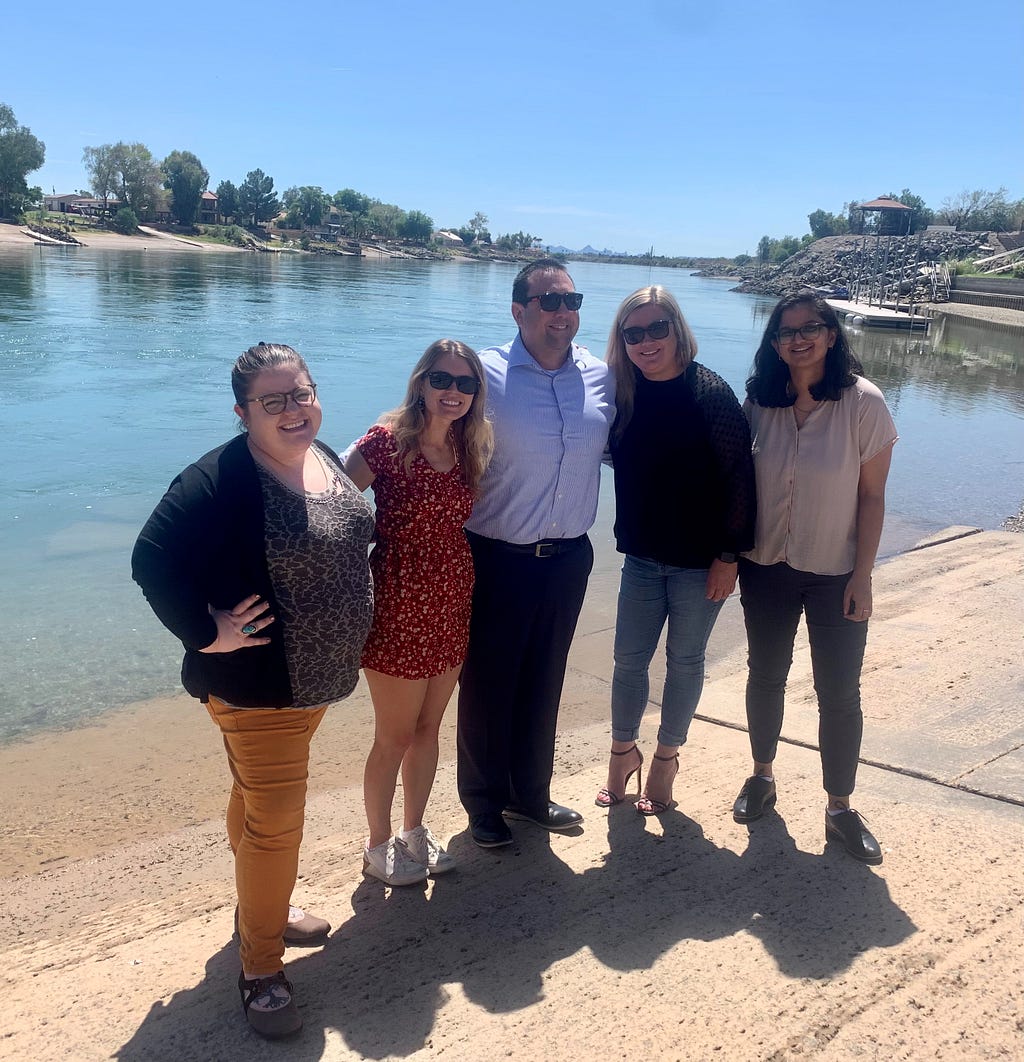 5 City of Needles and Boost Program staff standing in front of the Colorado River in Needles California.