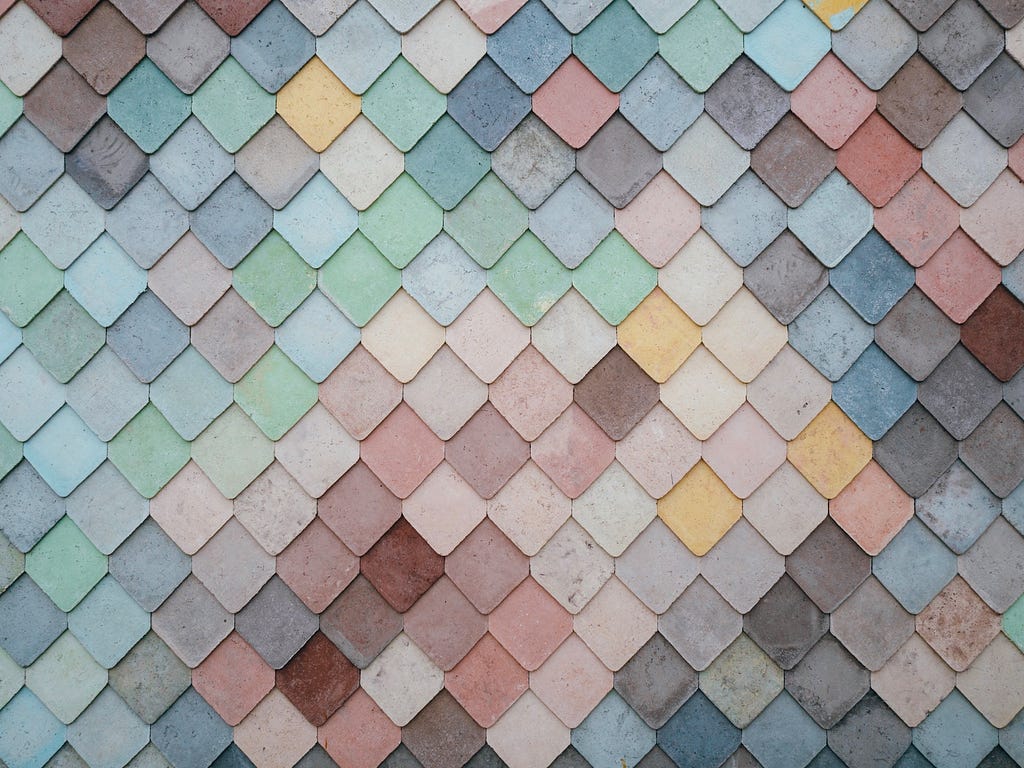 Different colored tiles symbolize the Design Debt of a website