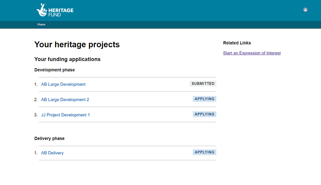 a screenshot of a page with a branded header in a teal colour. Below this, a heading reads ‘your heritage projects’ followed by a list titled ‘your funding applications. The list is subdivided into Development Phase and Delivery Phase applications. Each application in the list has a tag of either ‘applying’ or ‘submitted’