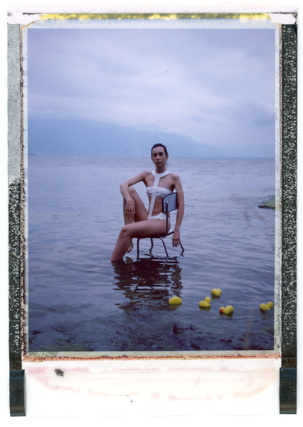Swimsuit model in the Lake of Geneva and fleeing ducklings.