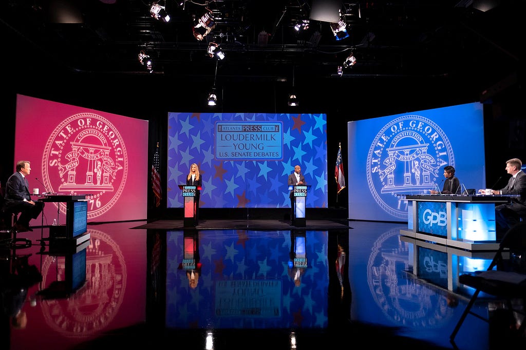 Incumbent Republican Senator Kelly Loeffler (Left) debates Democratic challenger Reverend Raphael Warnock (Right).