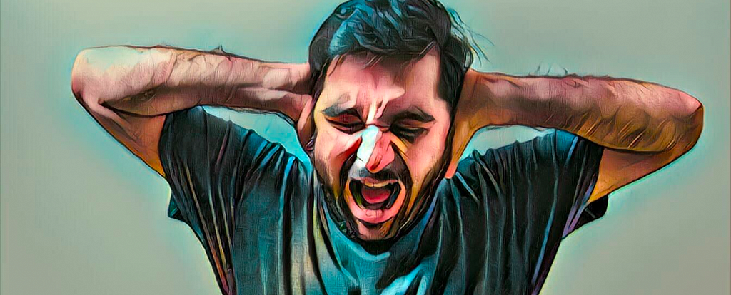 Illustratrive photo of bearded man screaming in frustration with his hands over his ears.