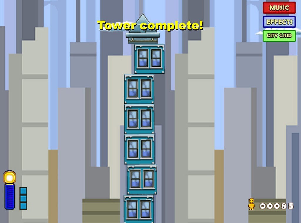 A screenshot from the game Tower Bloxx, in which the player builds a skyscraper by dropping block from a swinging rope hanging from a crane.