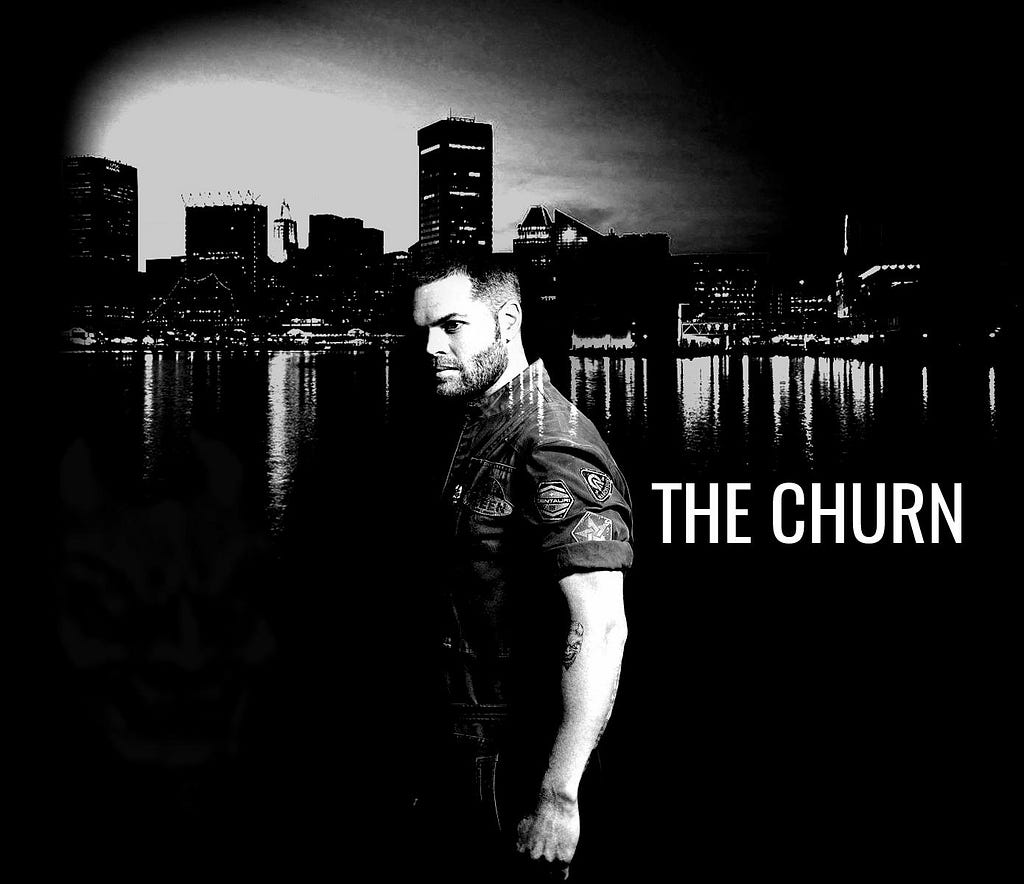 A black and white photo of Amos Burton from the TV show The Expanse next to white text that says “THE CHURN”.