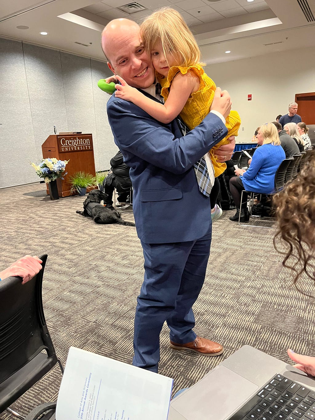 Me holding Nora at the ceremony.