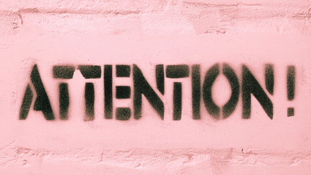 Image of the word “ATTENTION”