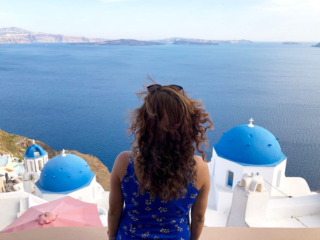 Lady looking at the blue sea