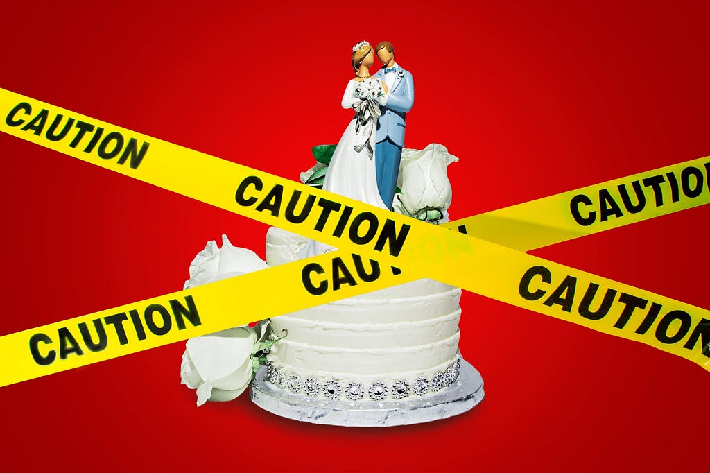 A wedding cake and “CAUTION” tape.