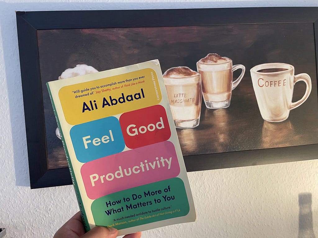 Feel Good Productivity Book in front of my coffee table