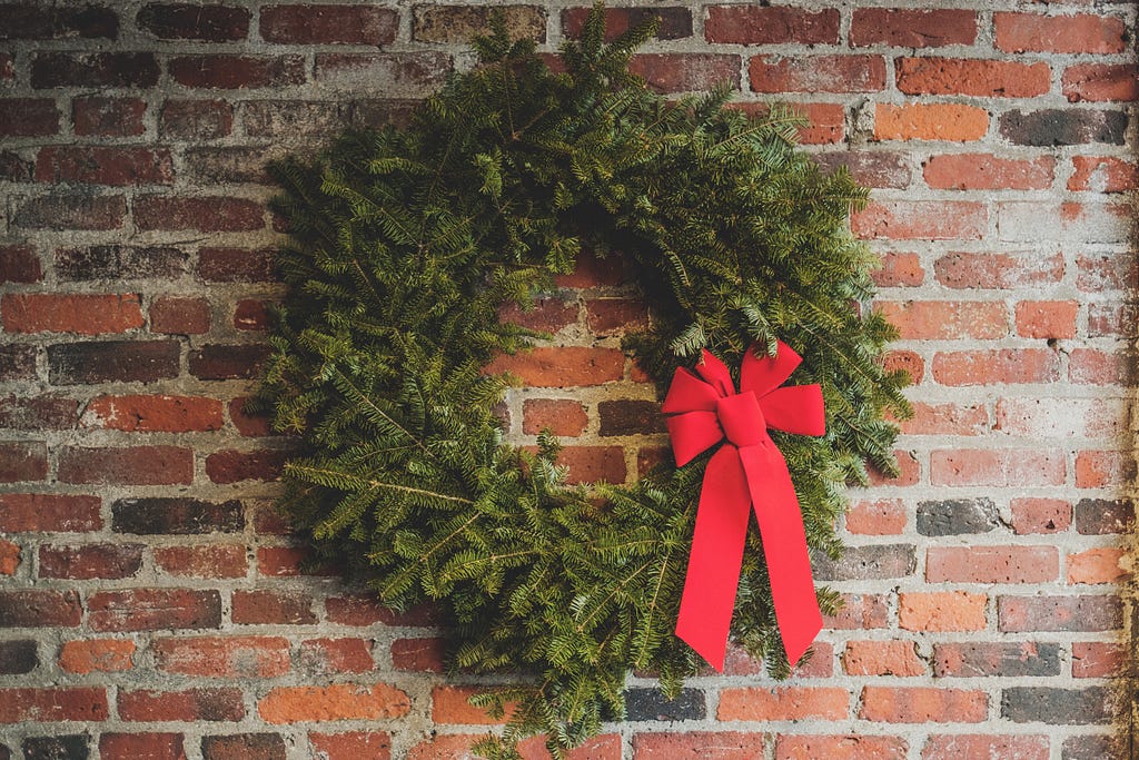 Incomplete Christmas wreath on wall