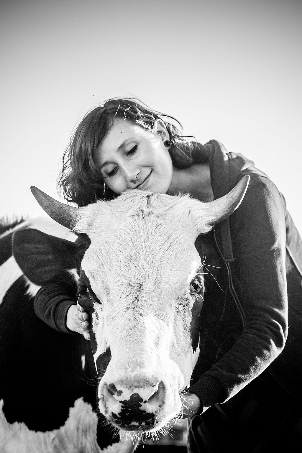 Marisol de la Reguera, co-founder of animal sanctuary Santuario Igualdad, hugs resident Salvador at the sanctuary. Salvador was still a calf and was dying of starvation when the sanctuary rescued him. Chile, 2015. Gabriela Penela / We Animals Media