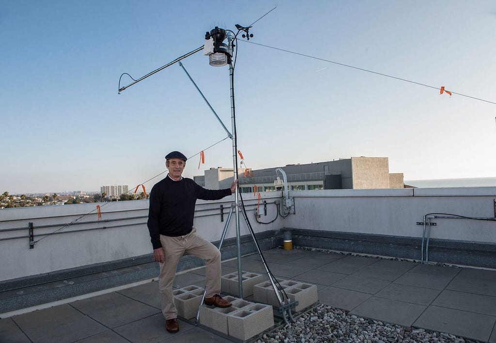 RAND researcher Robert Lempert with the newly installed array of data-generating sensors on the roof of RAND’s Santa Monica headquarters. Photo by Diane Baldwin/RAND Corporation