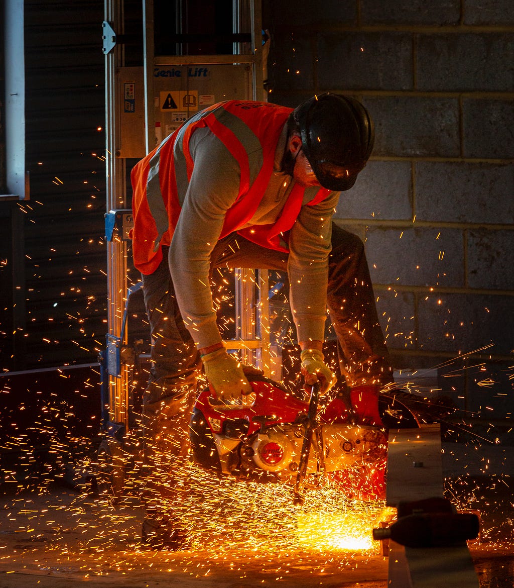 A workman overcoming procrastination by getting to work