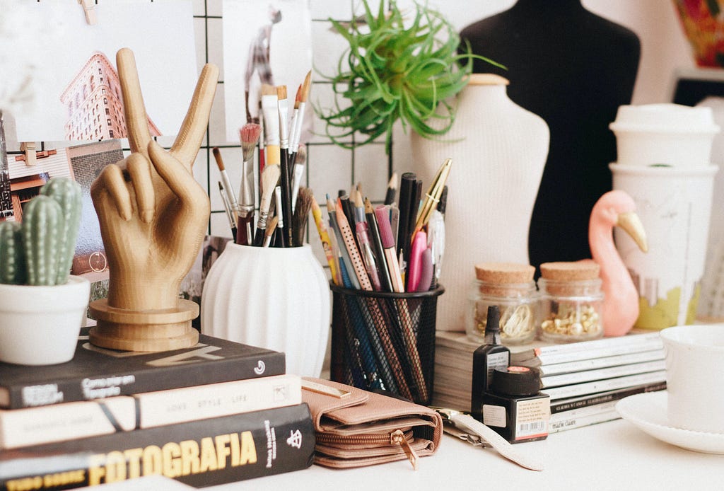 a desk filled with cute decorations to represent products one can opt to buy if given great product reviews