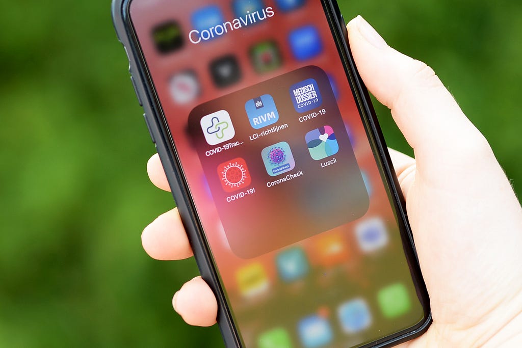 A photo of coronavirus-related apps on a person’s iPhone home screen.