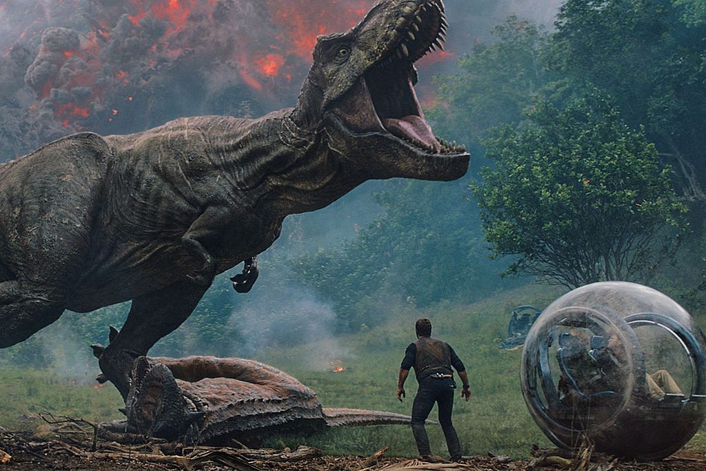 Chris Pratt standing before a roaring T-Rex.