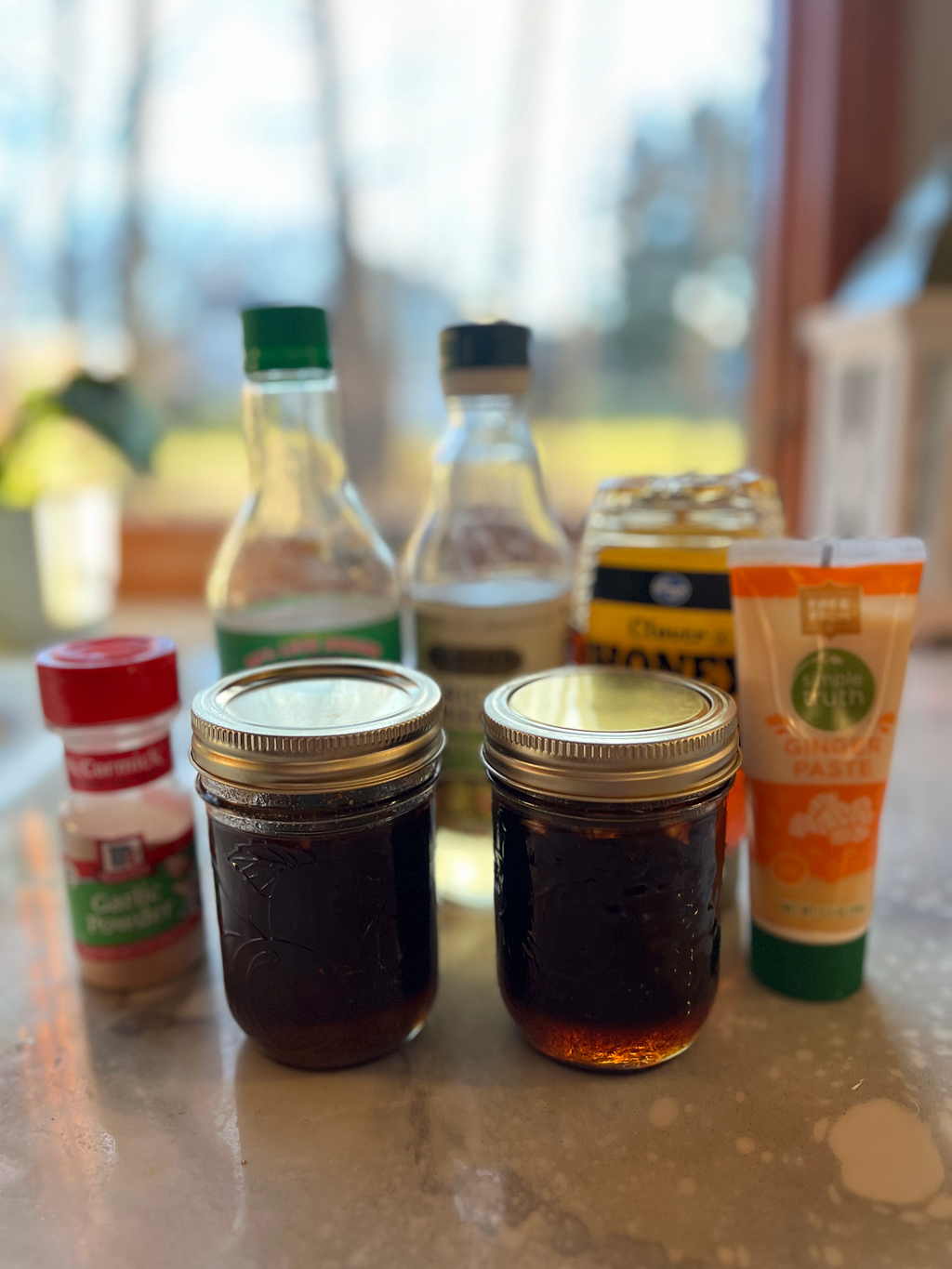 Two servings of stir fry sauce in front of the ingredient used to make it