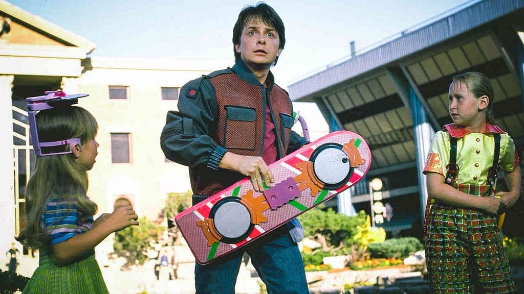 Marty McFly, played by Michael J. Fox, holding a hoverboard in a scene from Back to the Future 2