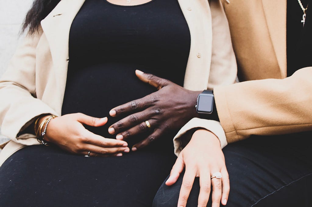 Alysia Davis while pregnant, with her husband. Photo courtesy of Alysia Davis