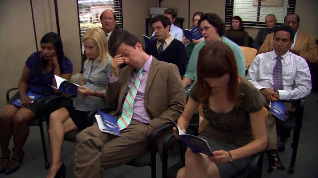 Scene from a boring meeting in the TV show The Office