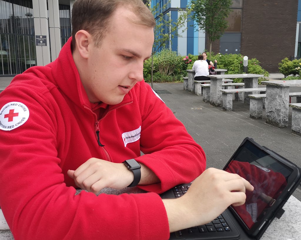 Service Coordinator using tablet outside of a hospital