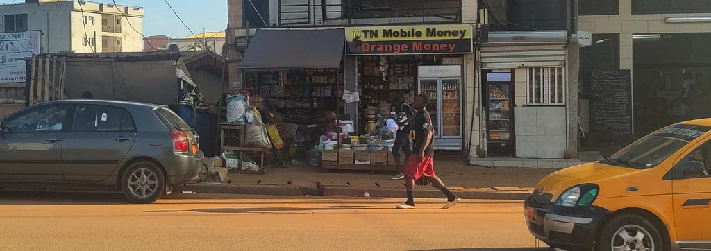 Small shop with MTN Mobile Money and Orange Money signs
