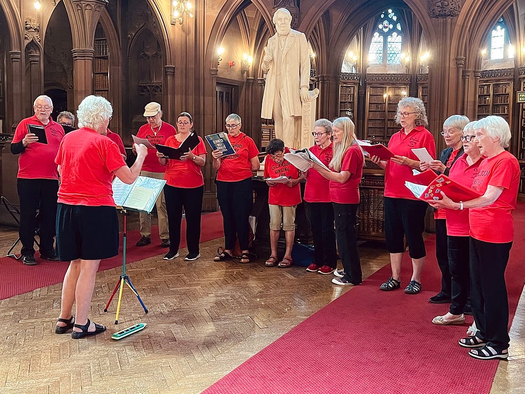 Image of the Bolton Choir performing in the Rylands Historic Reading Room