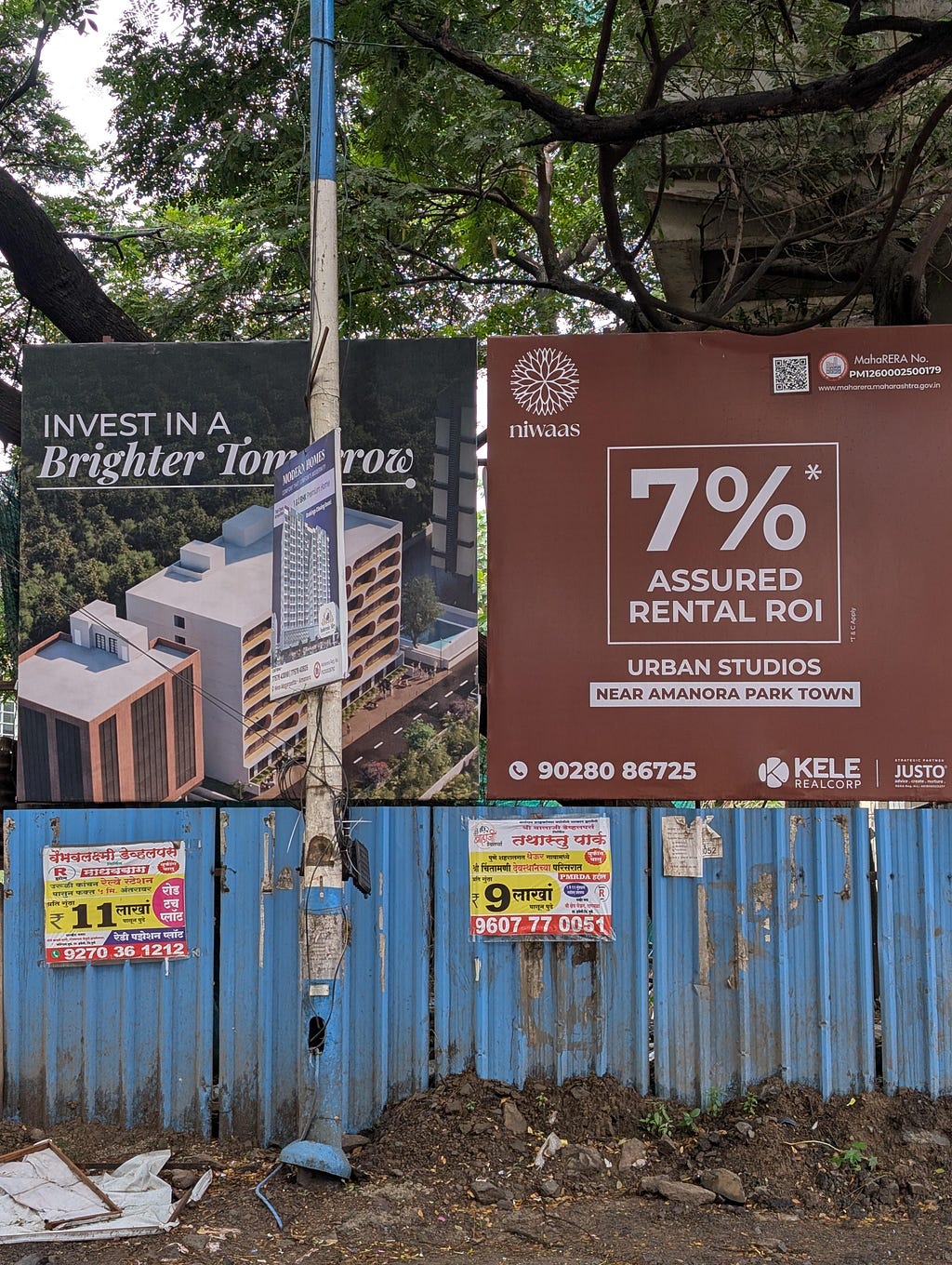 Billboards promoting real estate investment and rental properties, featuring the phrases ‘Invest in a Brighter Tomorrow’ and ‘7% Assured Rental ROI’.
