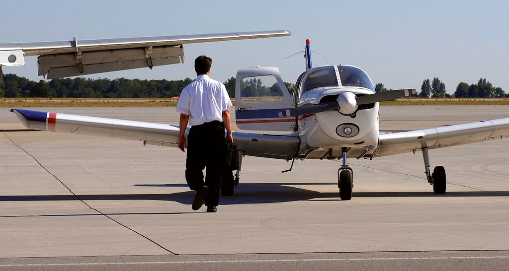 Phot of pilot and airplane.