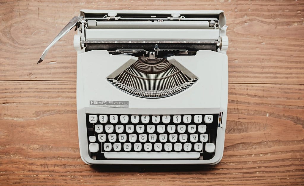 White typewriter via Unsplash