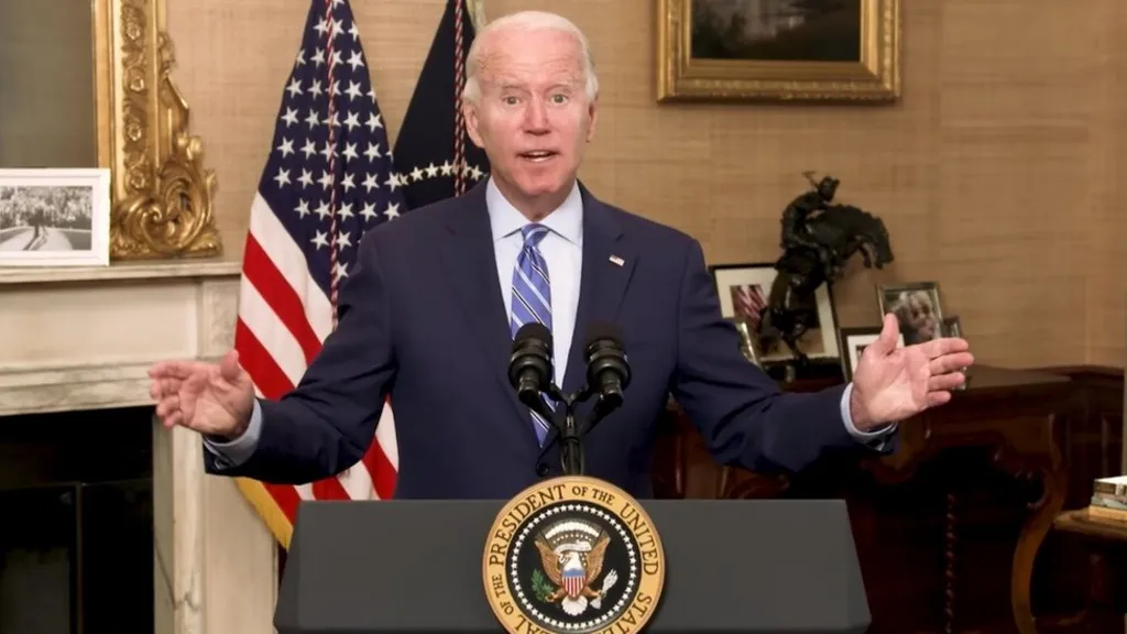 President Joe Biden giving speech in front of podium