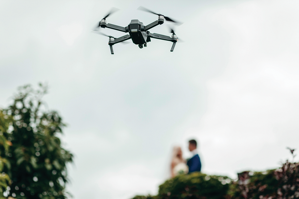 Photo of a drone over a wedding.