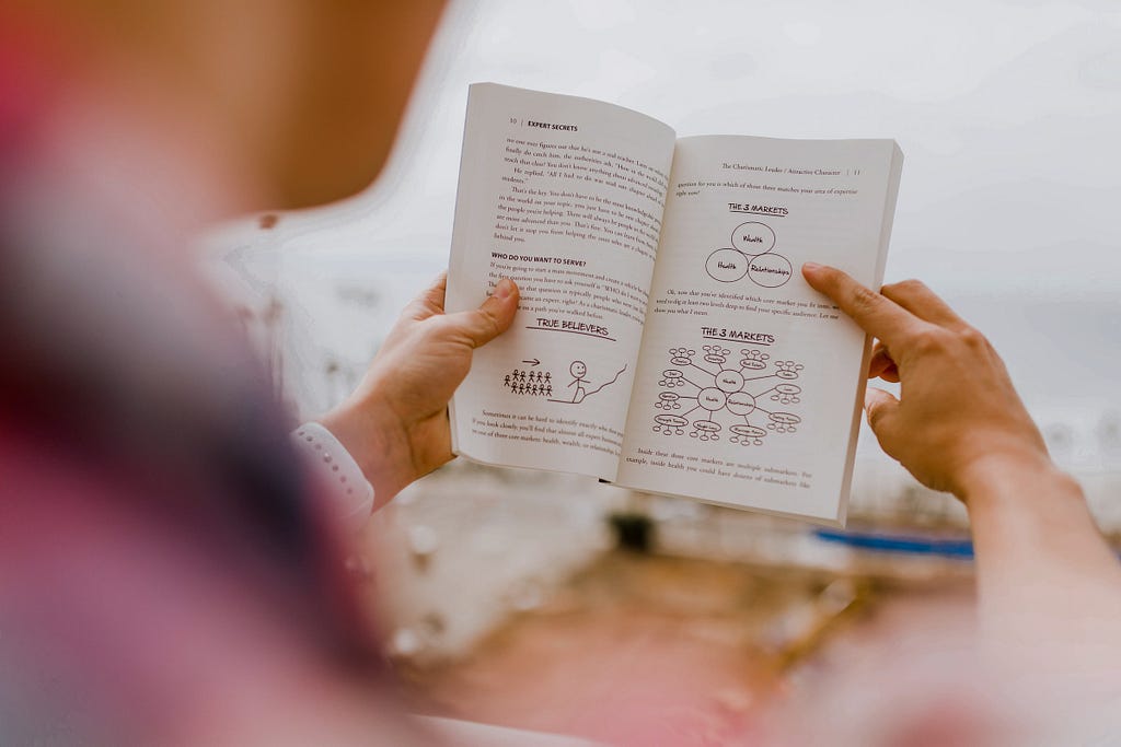 Person reading personal development book