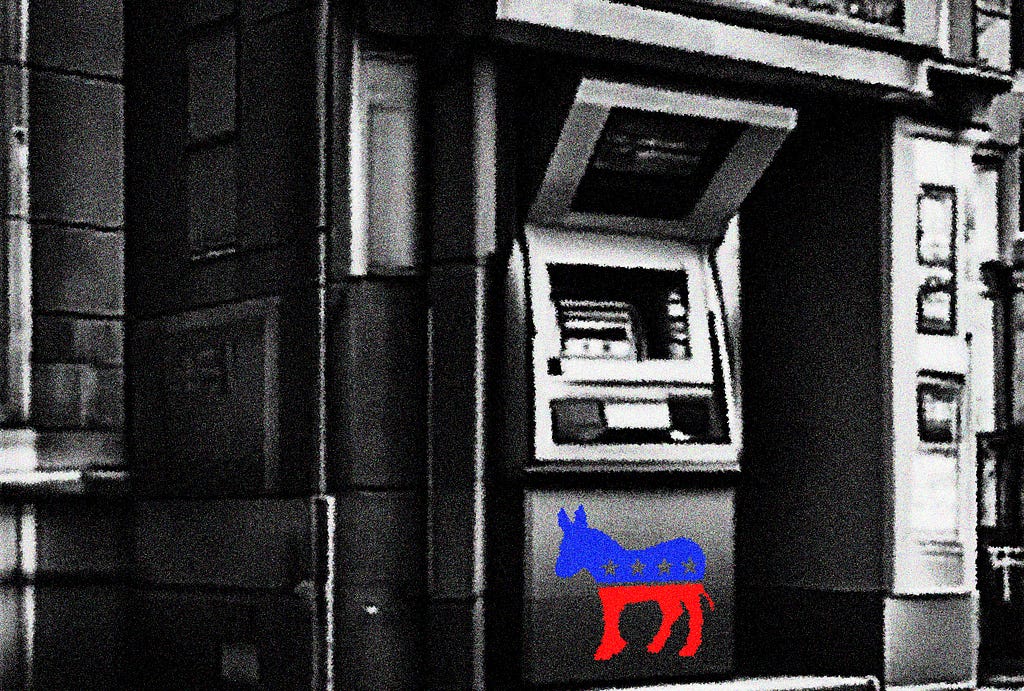 An ATM on a street corner with the Democratic Party logo of a blue and red stylized donkey with stars on its body. The image is in grainy, stark black and white except for the donkey.