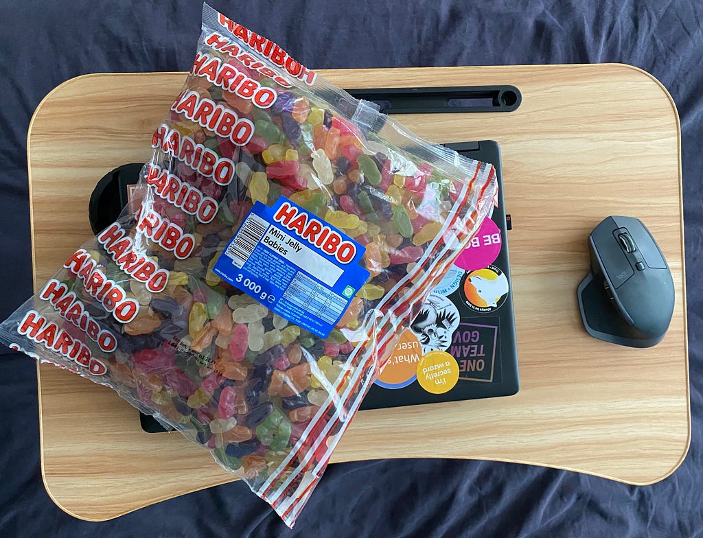 3kg of jelly babies on top of a laptop.