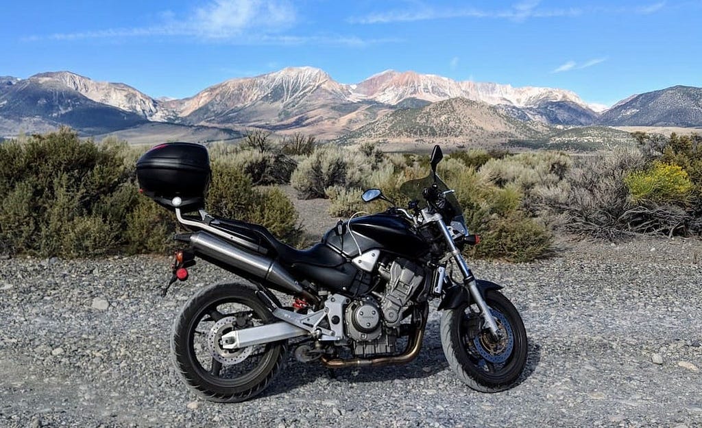 Honda CB900 motorcycle in front of western sierras, california