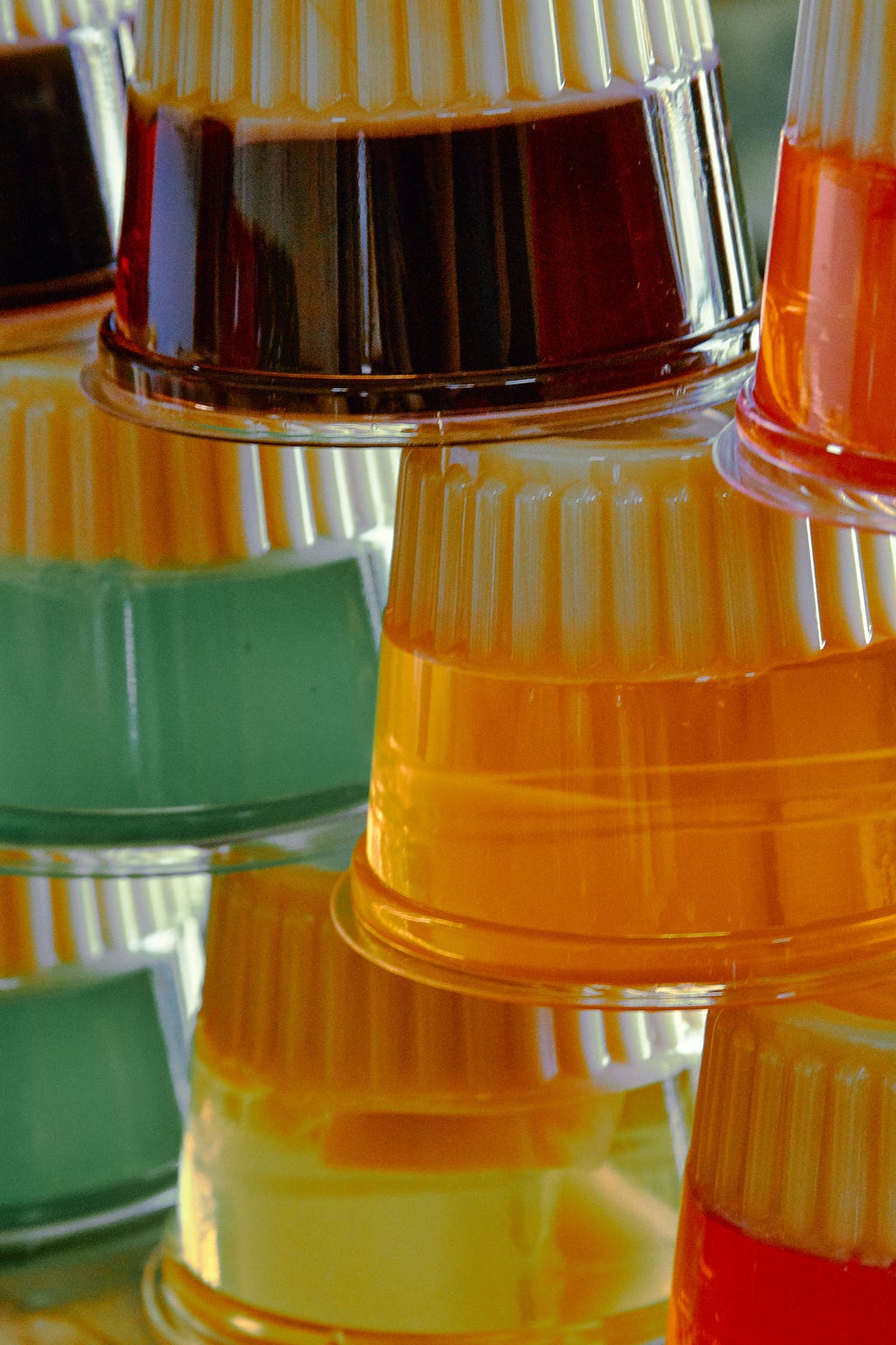 Photo of stacked plastic cups of Jell-o — photo by Girl with a red hat and Unsplash.