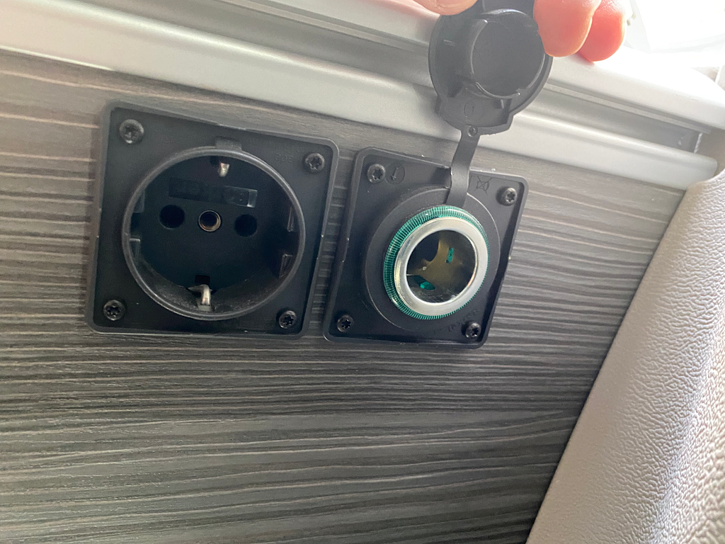 VW California kitchen 12v outlet with cover removed.