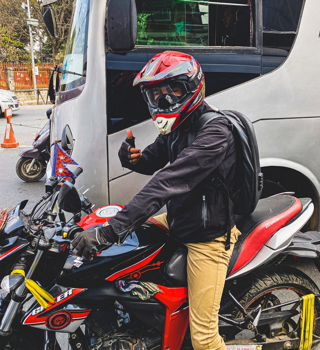 Motorcyclist at a red light in Kathmandu, Nepal. Photo by Author.