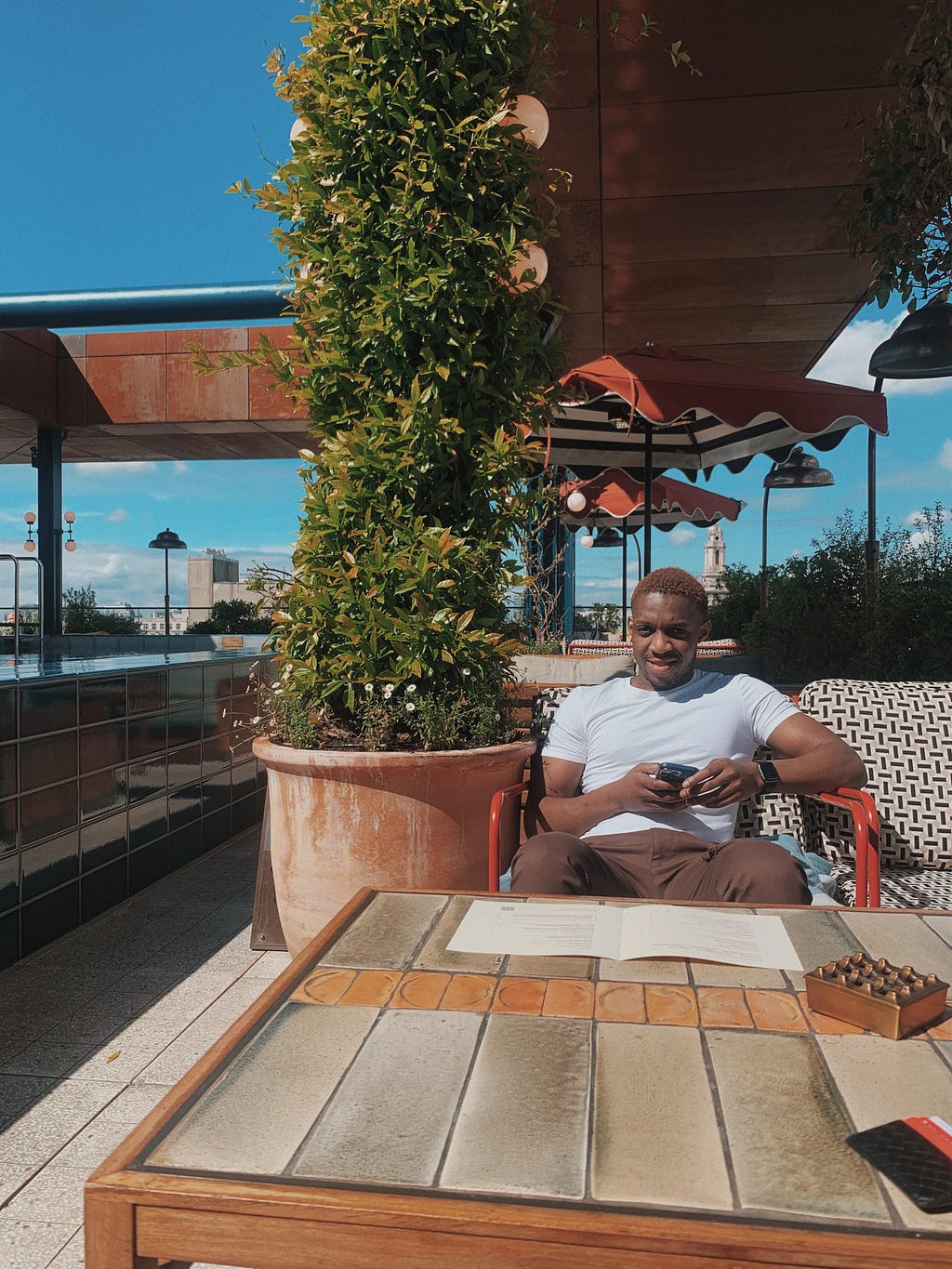 Claude on the rooftop of Soho House during his time working there as a UX designer.