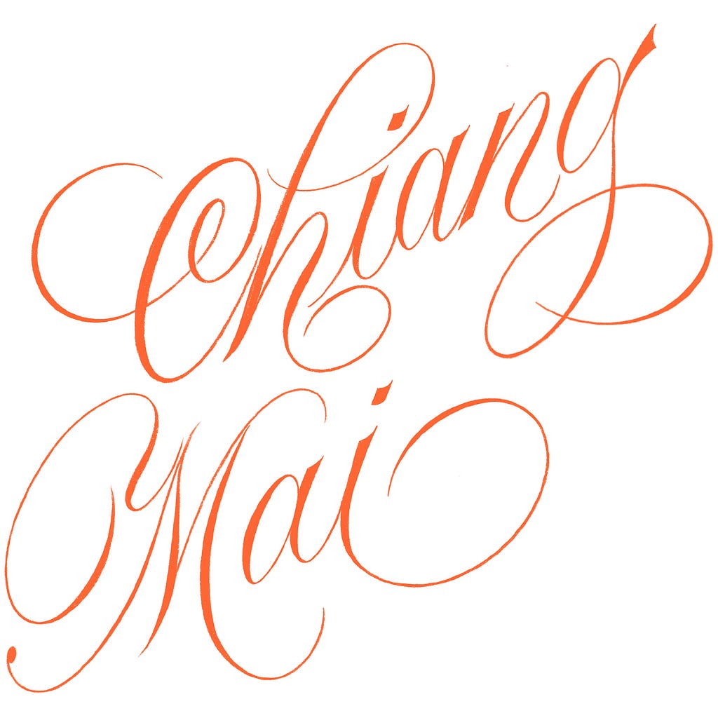Chiang Mai script lettering design in orange colour over a white background