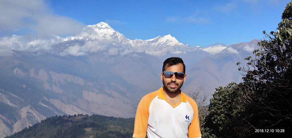 Trekking guide Sudip Adhikari with Dhaulagiri ranges on Background during Khopra Danda Trek